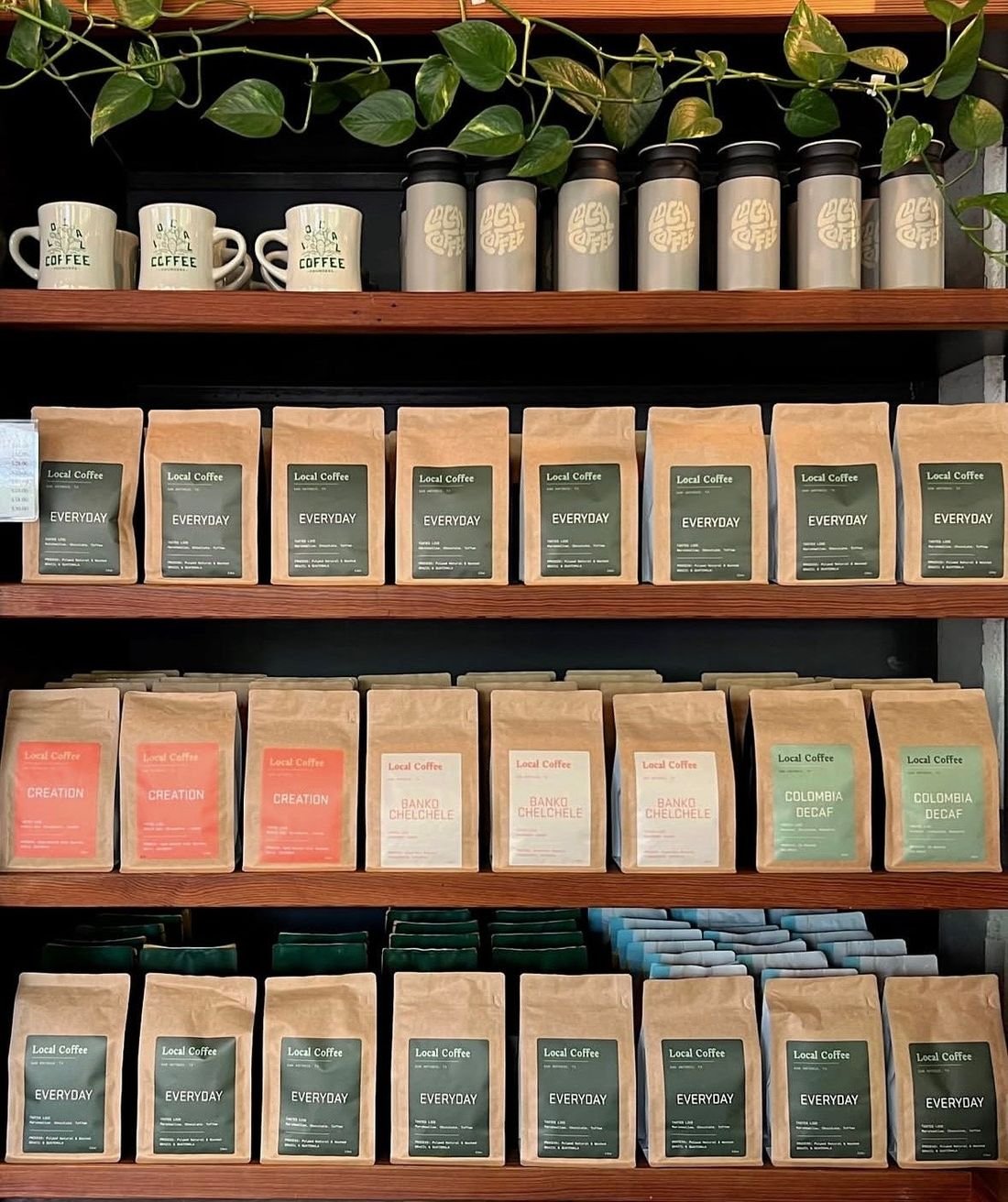 Wall of coffee bags from San Antonio roasters